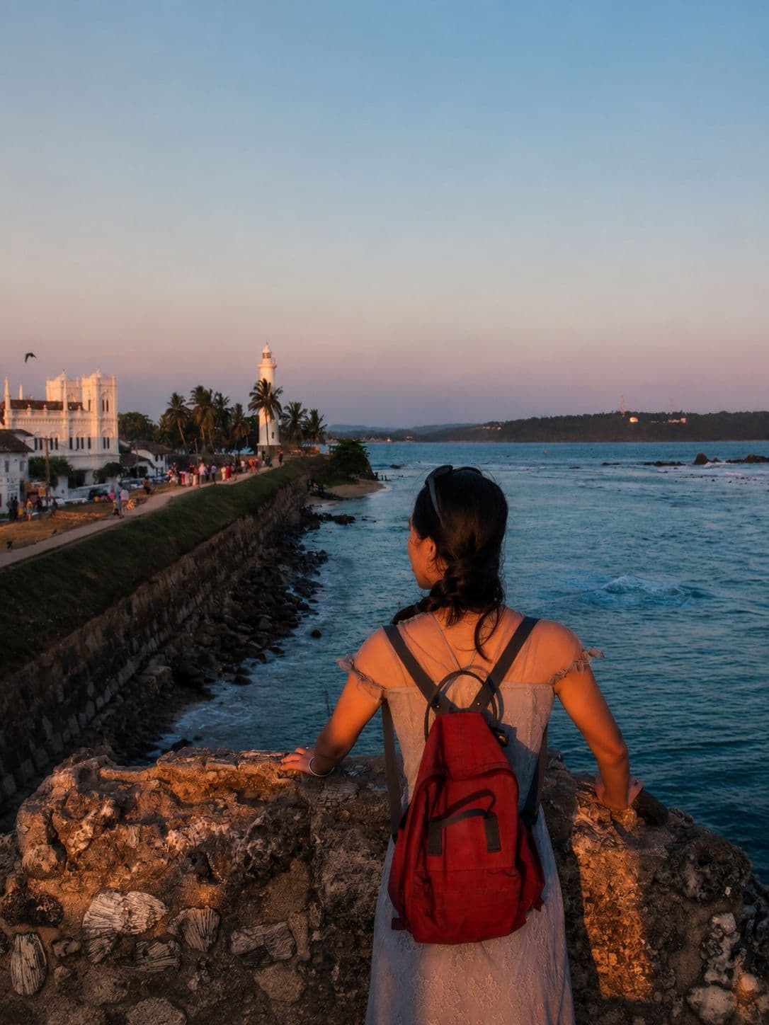 The Galle Fort ramparts and lighthouse in the last light before sunset